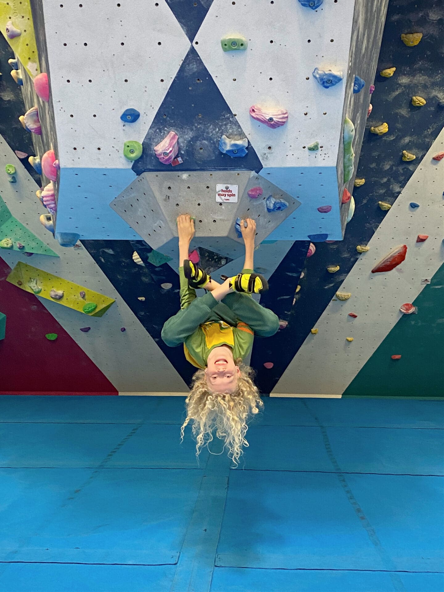 Child at bouldering wall