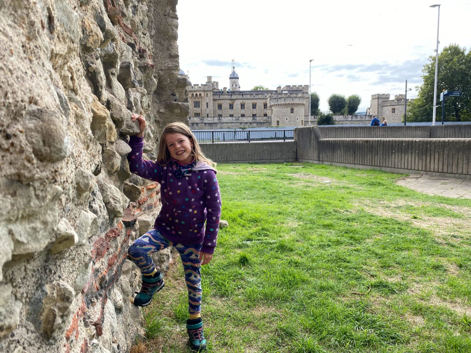 Child at Roman wall in London