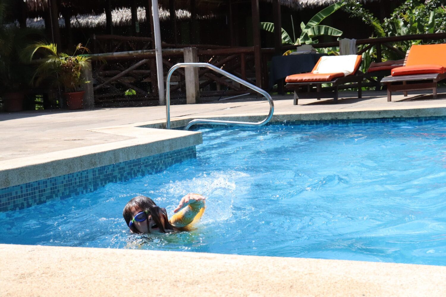 Child swimming in pool