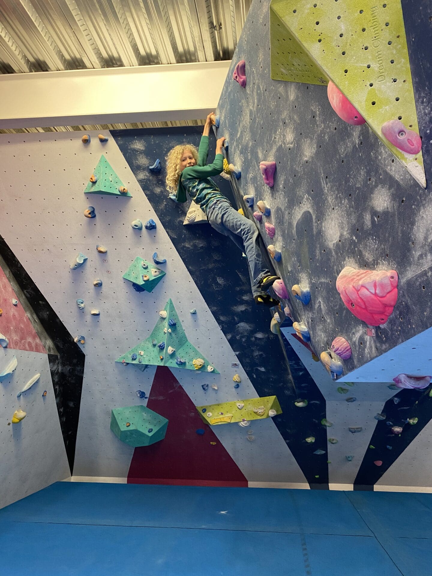 Child climbing on bouldering wall