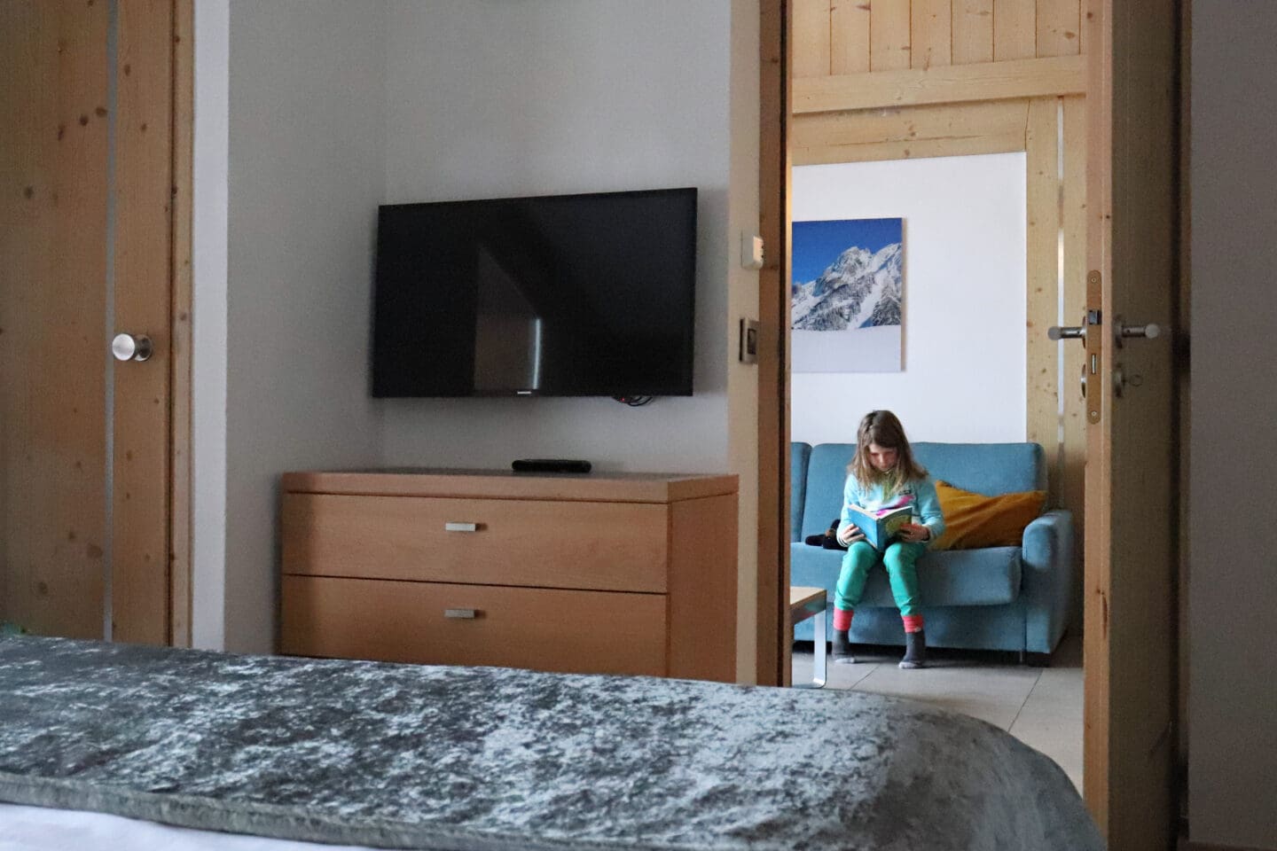 Child reading a book at hotel Les Roc de Tours
