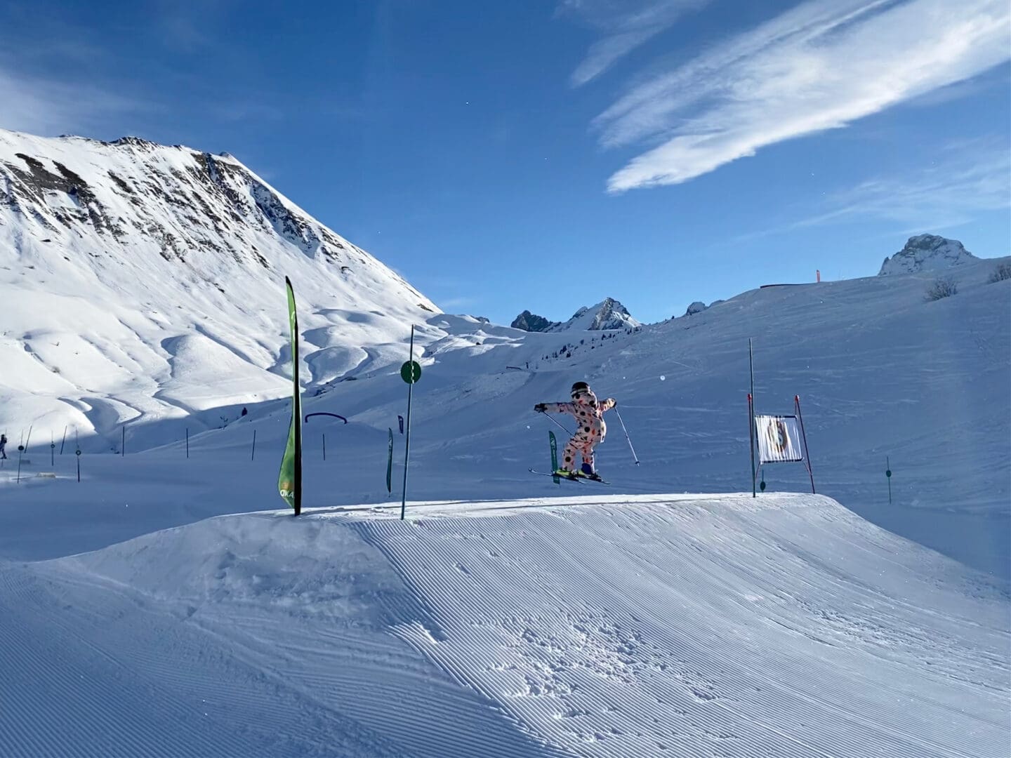 Child jumping on easy ski jump at Les Grand Bornand