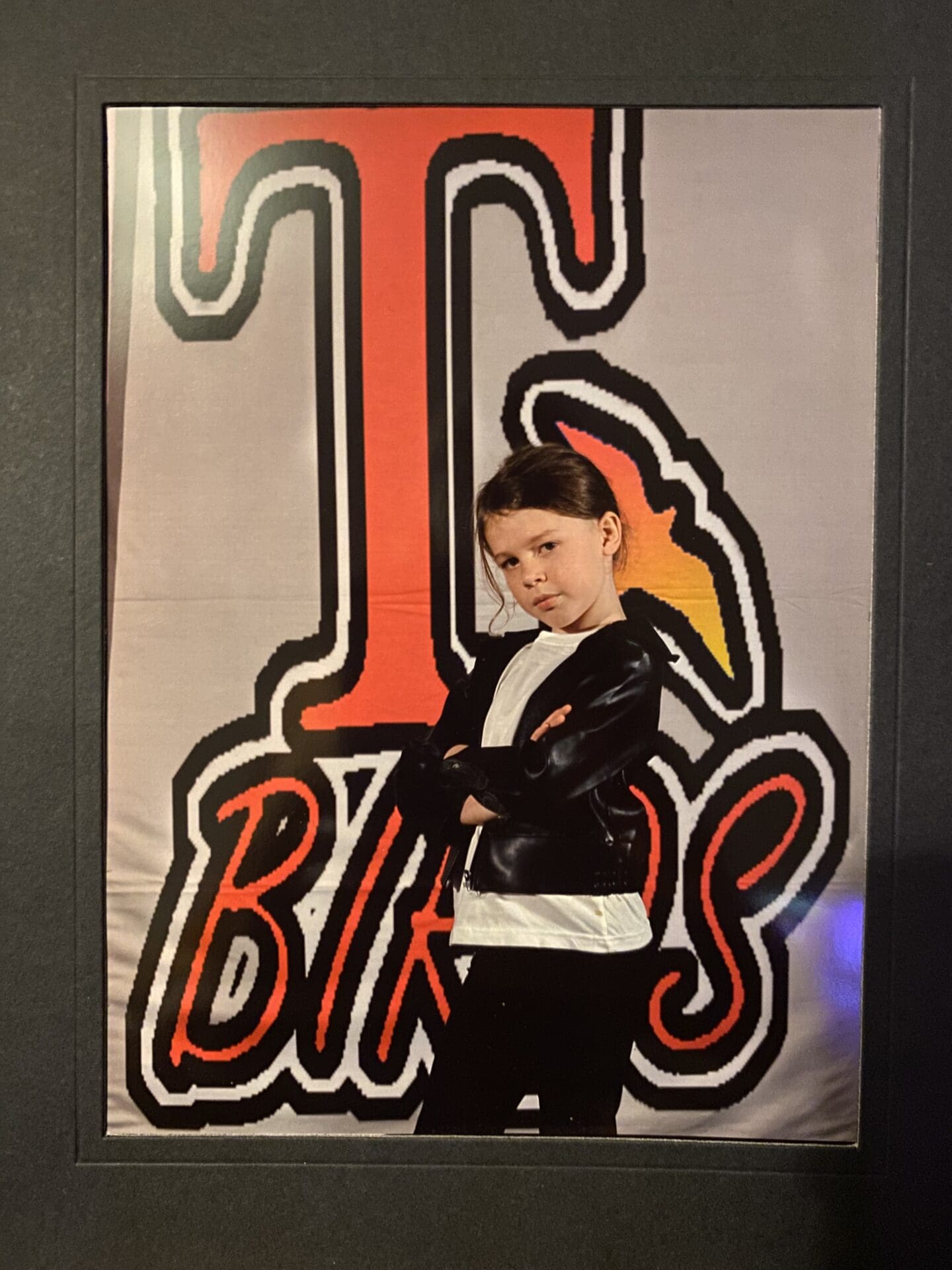 Child dressed as Danny from Grease