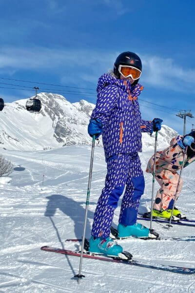 Children in ski suits and on in skis