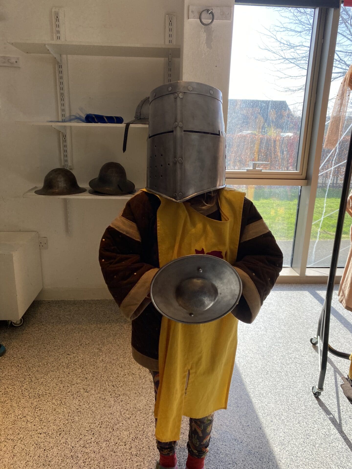 Child dressed up in medieval knight outfit