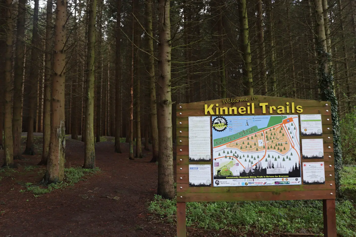 Kinneil bike trails sign in the woods