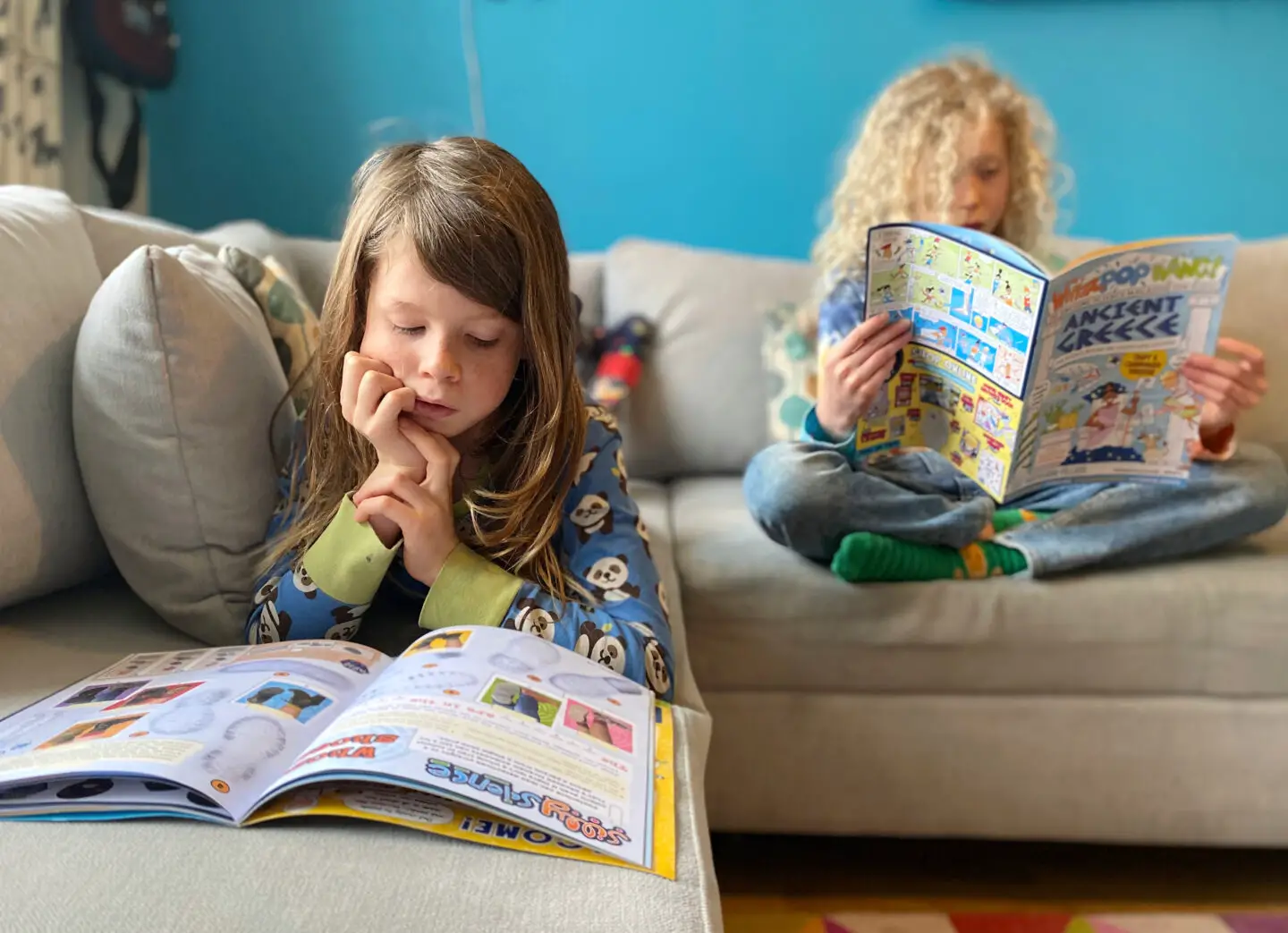 Children reading educational science magazine UK