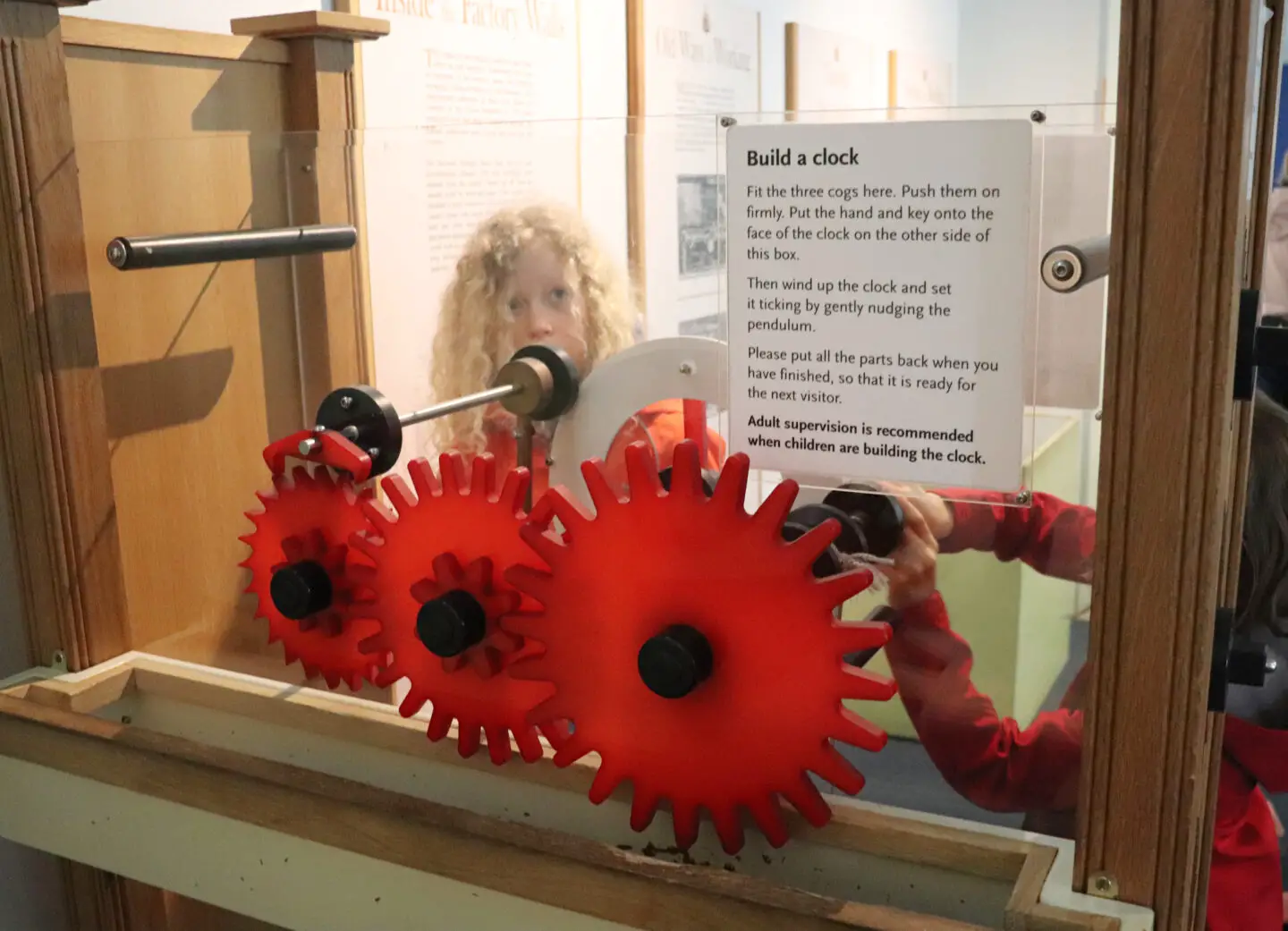 Children making a working clock tick at Callendar House museum
