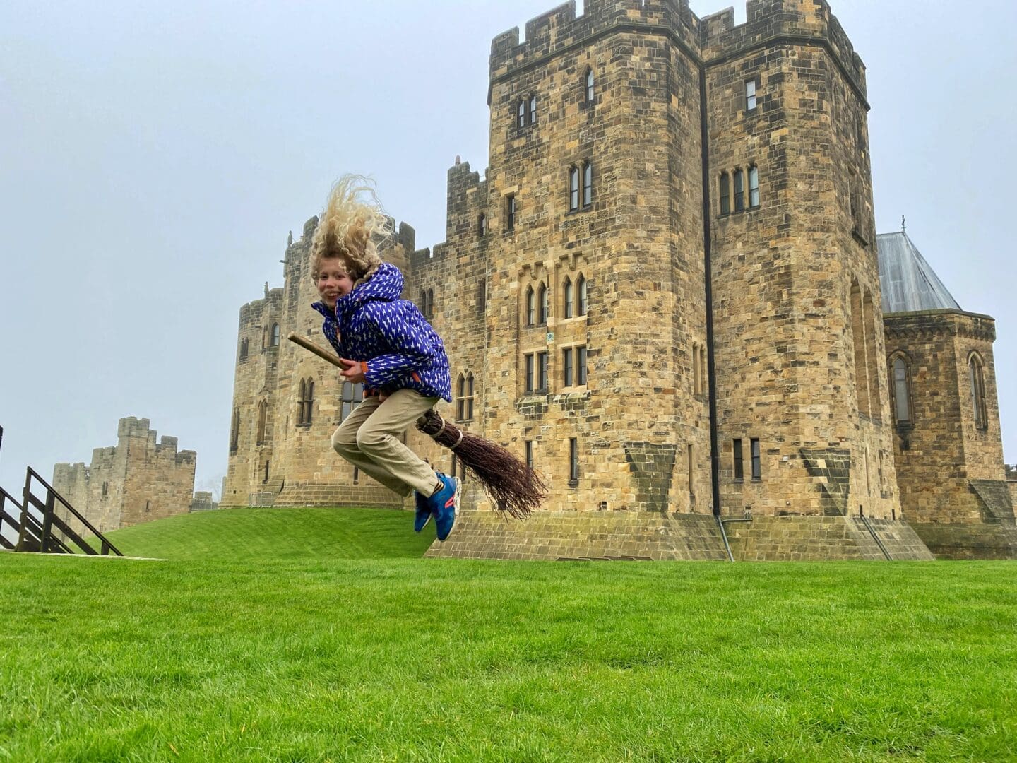 Child flying broomstick at Alnwick castle