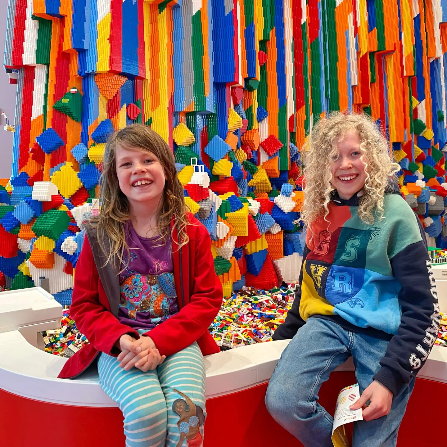 Children beside Lego waterfall at Lego House