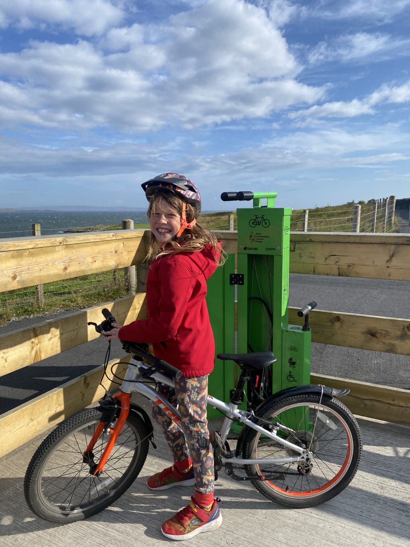 Child at tool station on bike path