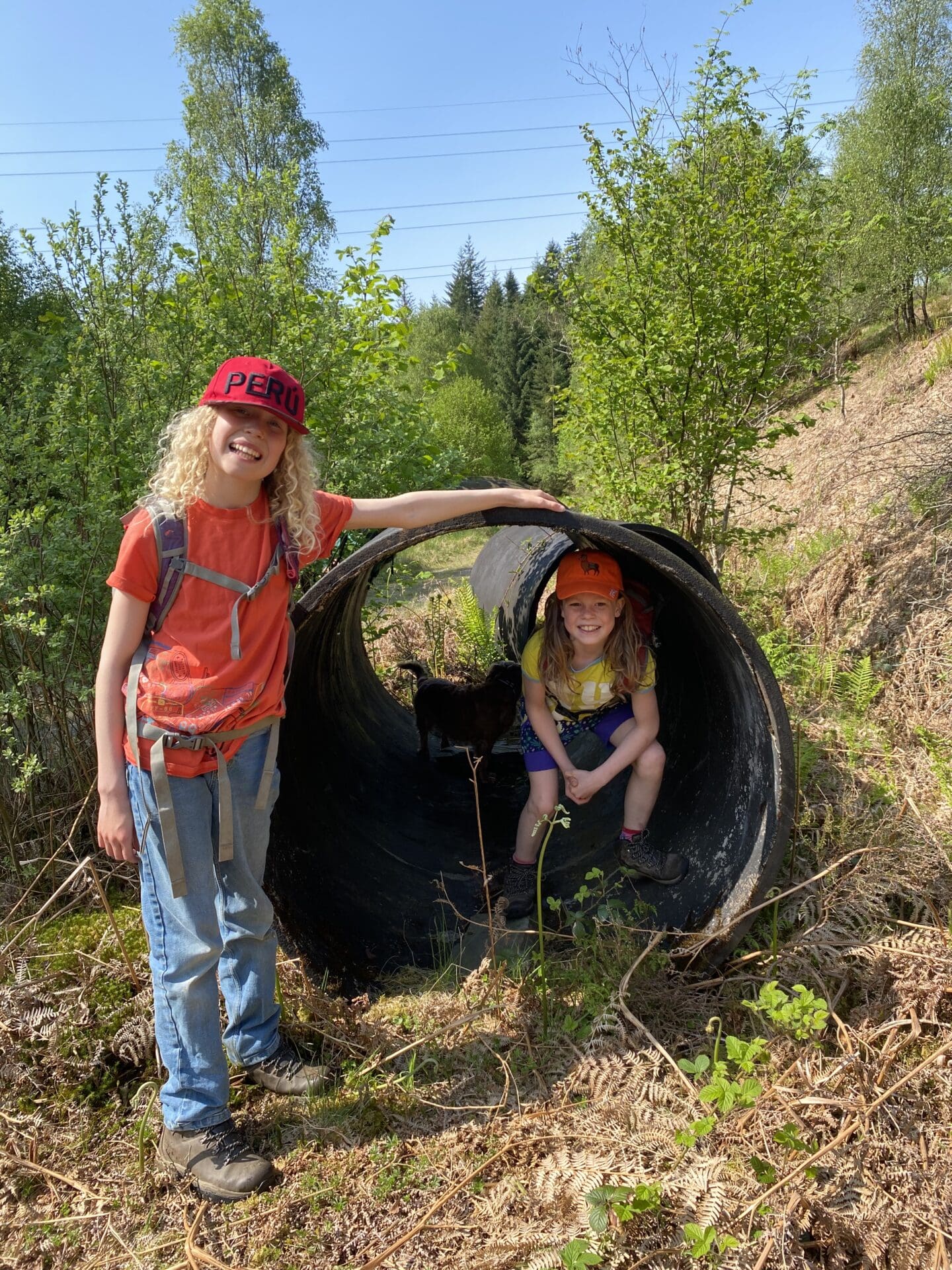 Children in old pipe from aquaduct