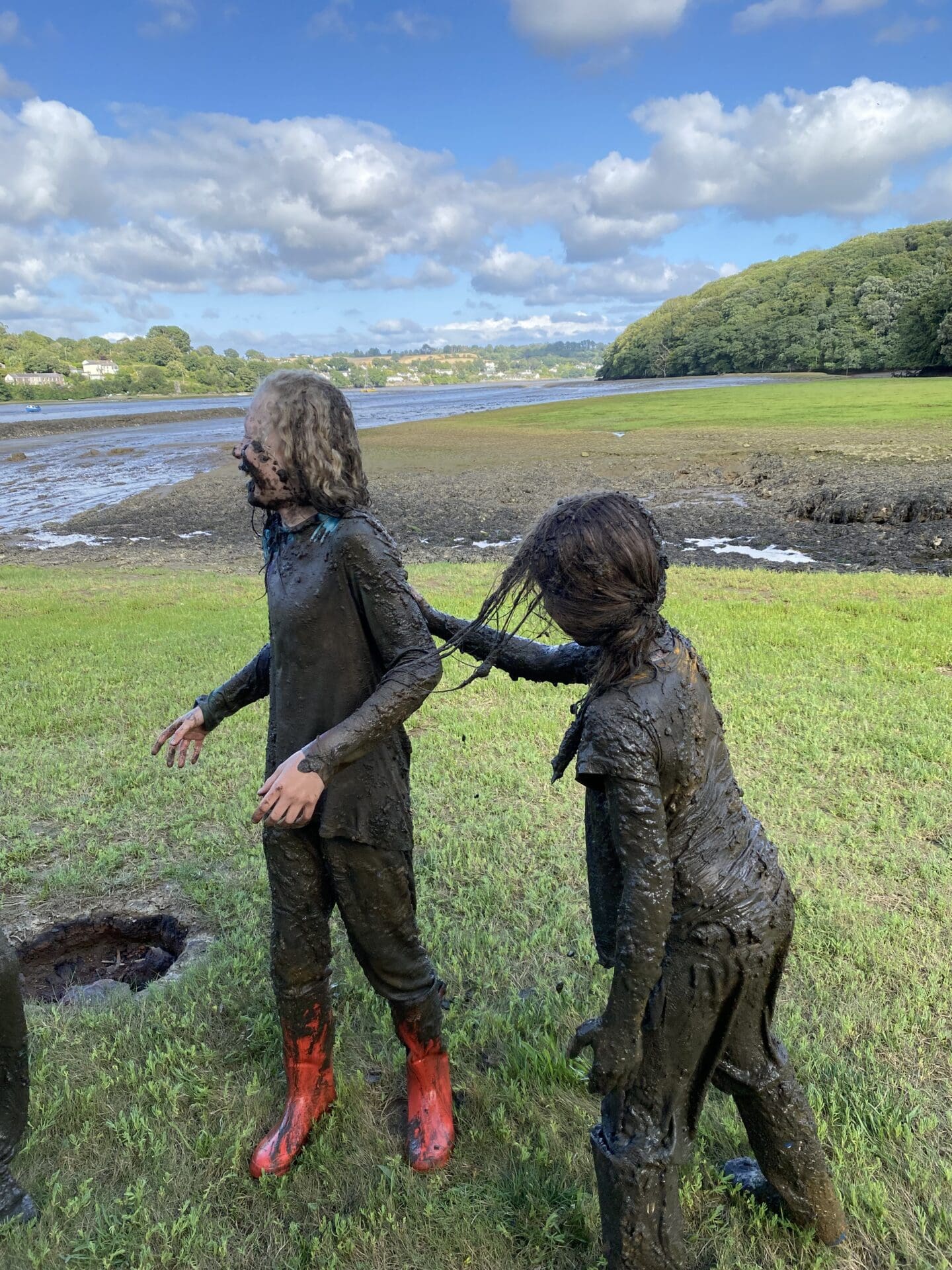 Children covered in mud