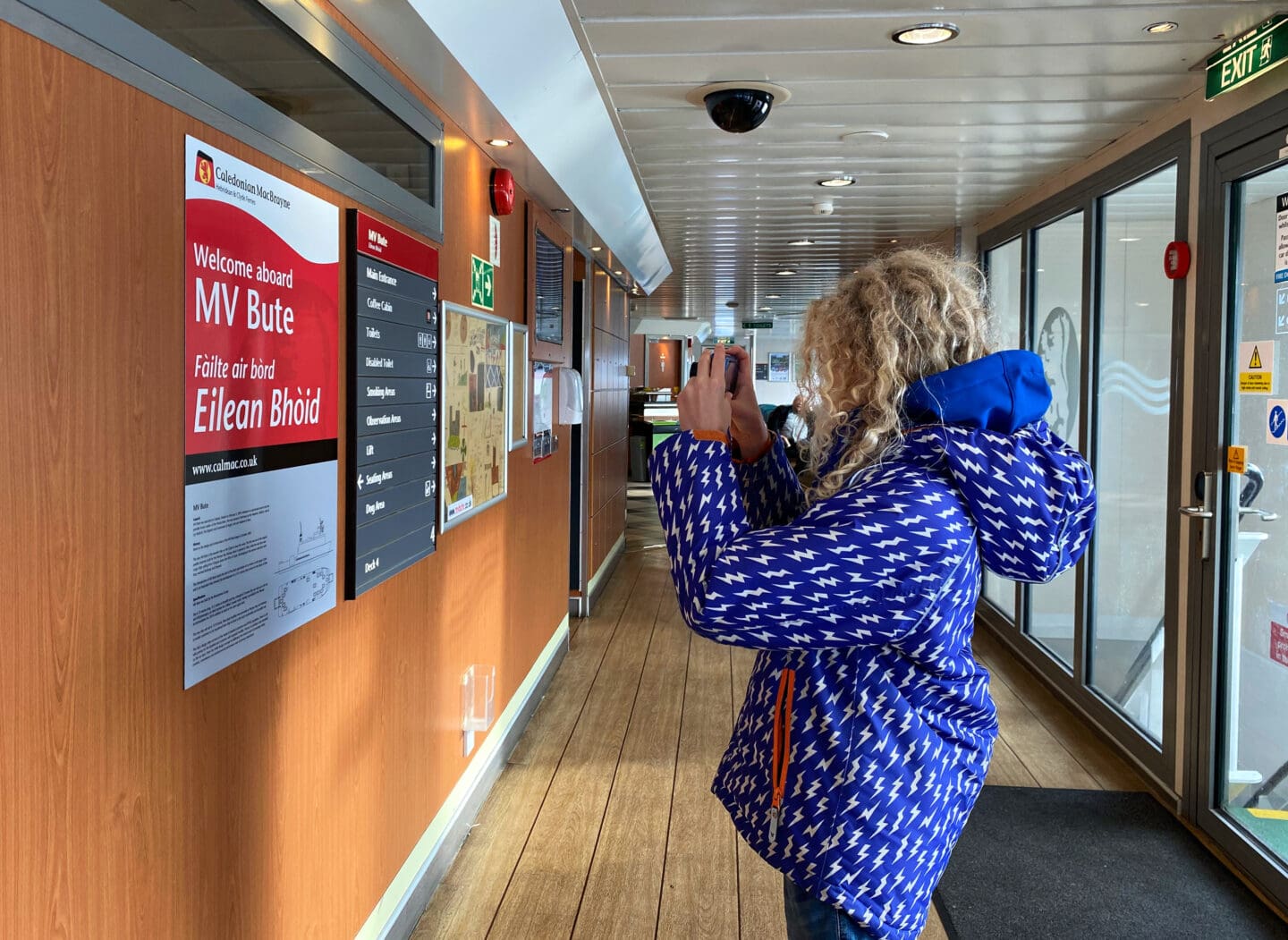 Child taking photo on MV Bute