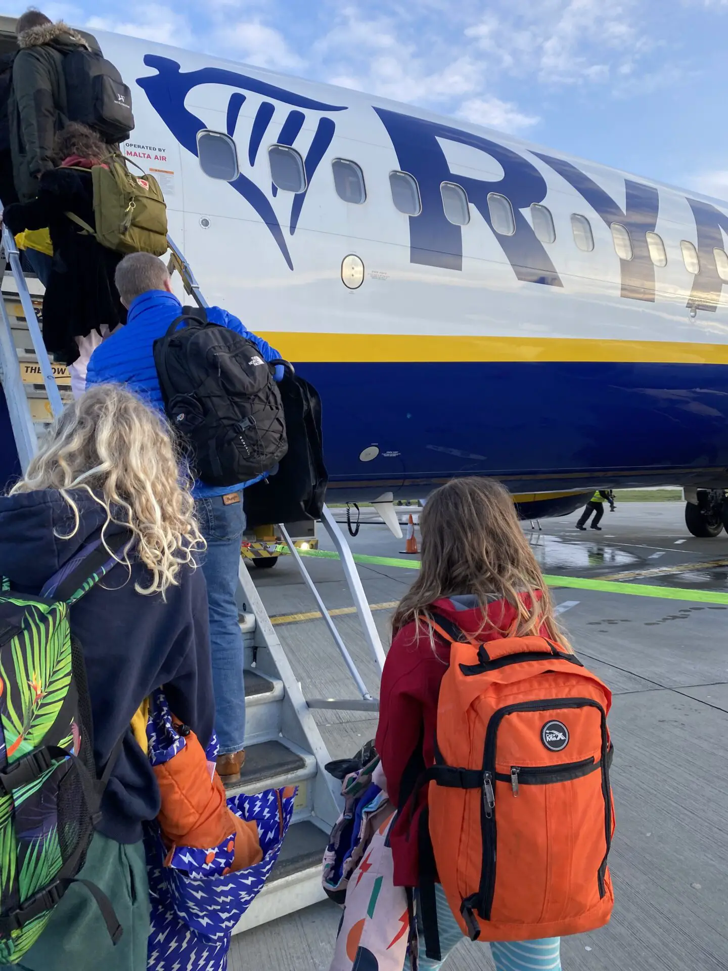 Kids getting on plane