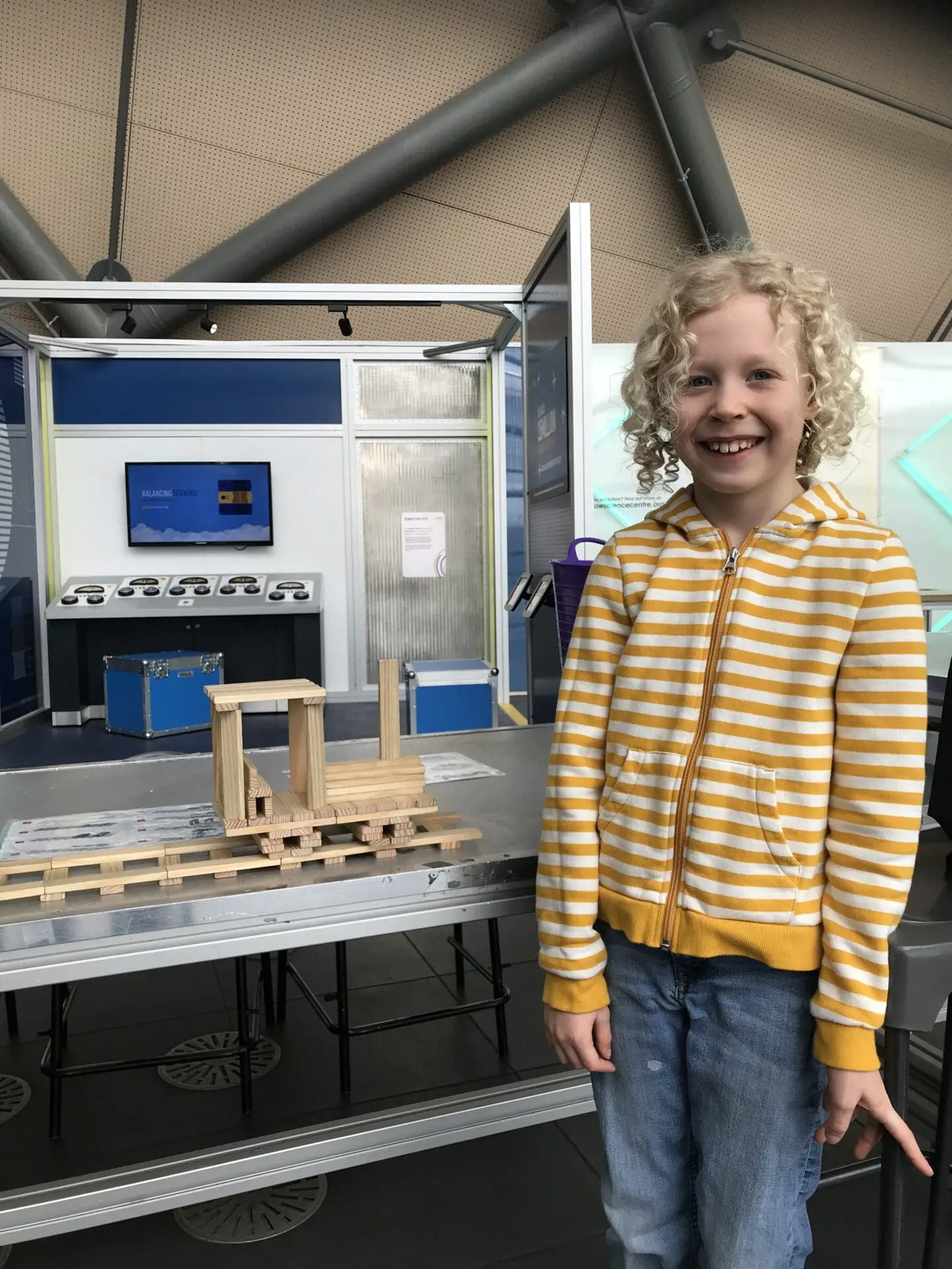 Child building train with blocks at science centre