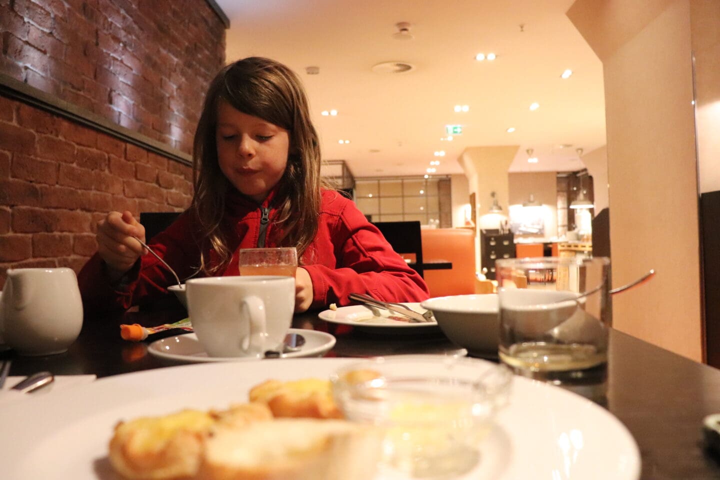 Child having breakfast in hotel