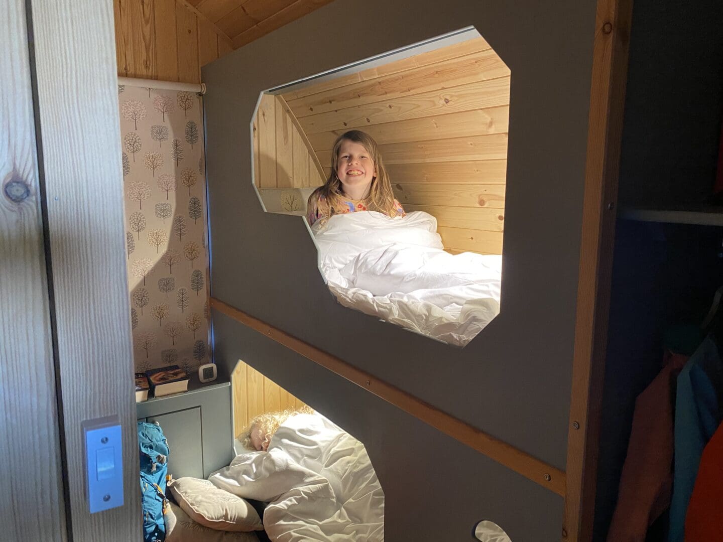Children in glamping pod bunk beds