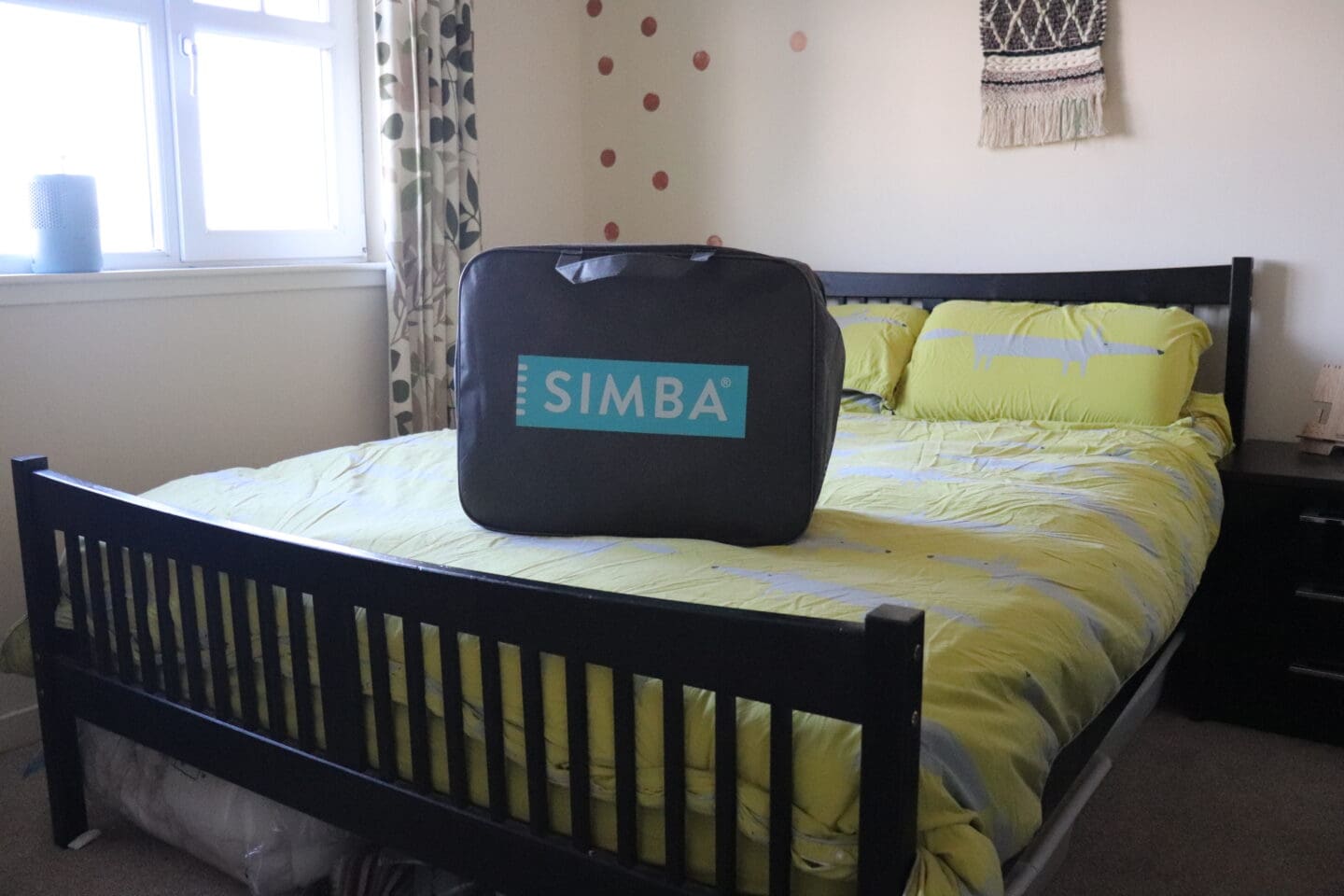 Simba bag on bed green duvet with foxes