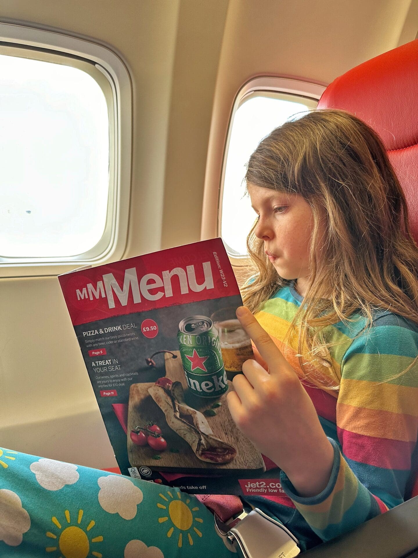 Child reading a Jet2 menu
